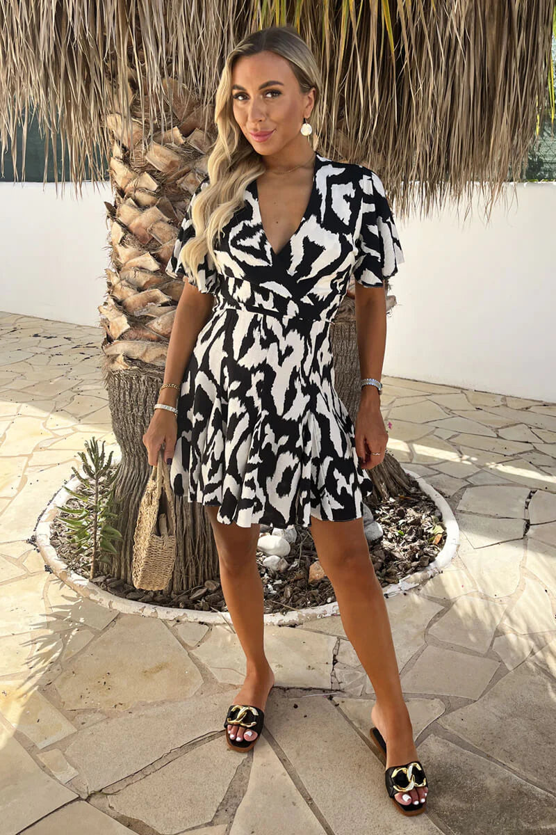 AX PARIS BLACK AND WHITE ABSTRACT PRINT WRAP TOP SKATER MINI DRESS