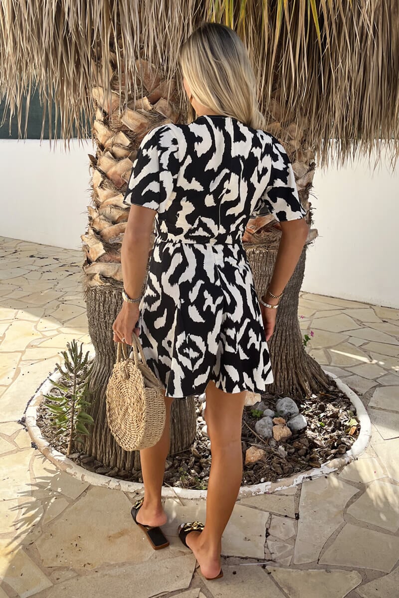 AX PARIS BLACK AND WHITE ABSTRACT PRINT WRAP TOP SKATER MINI DRESS