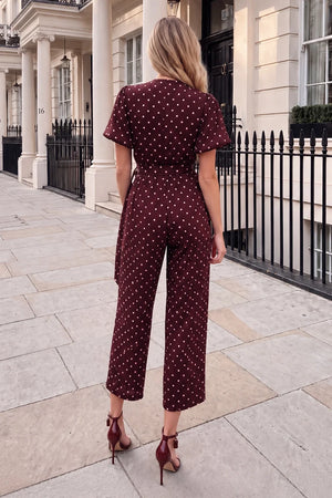 AX PARIS BURGUNDY POLKA DOT BELTED WRAP JUMPSUIT
