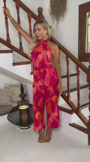 AX PARIS PINK AND ORANGE SMUDGE PRINT HALTER NECK TIE WAIST JUMPSUIT